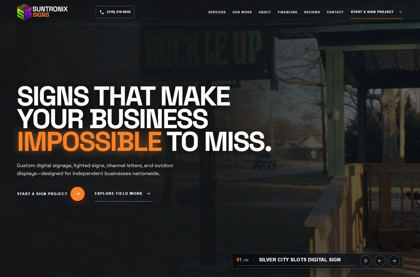 Suntronix Signs’ homepage pairs bold orange typography with real illuminated sign projects.
